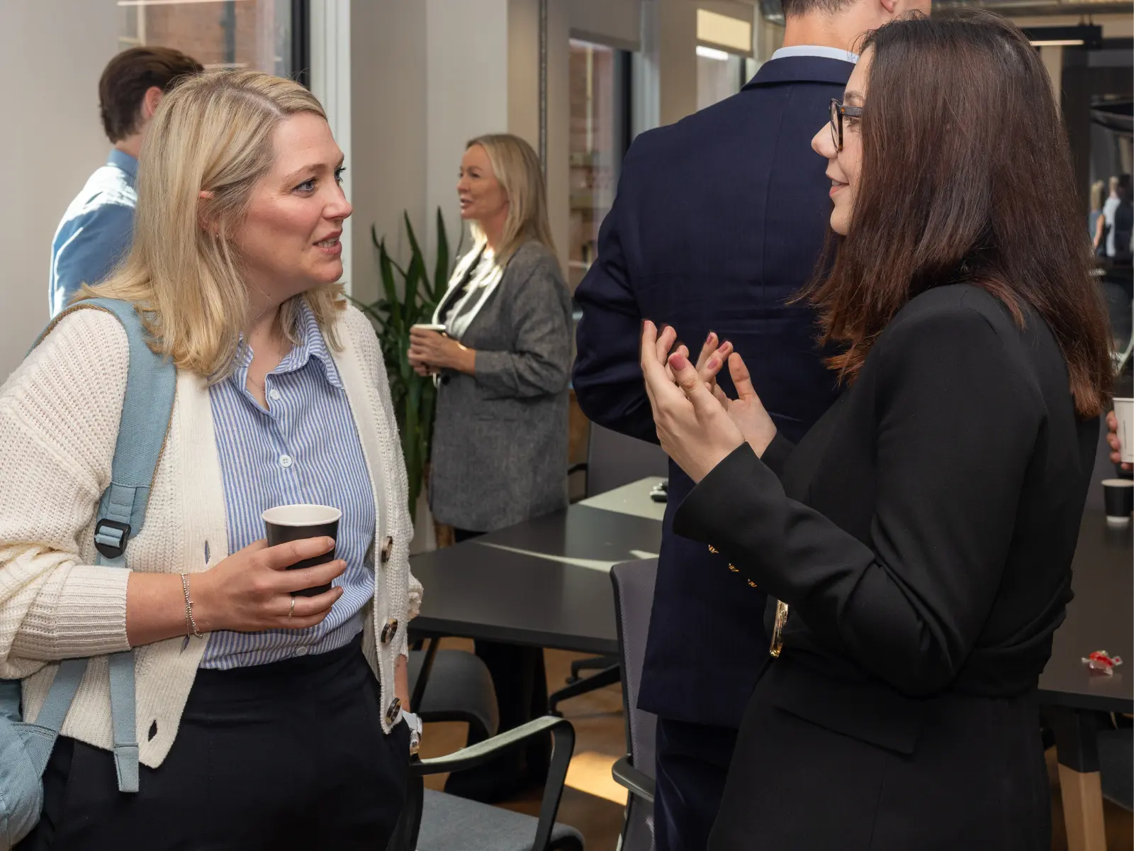 Amelia Hewitt having a conversation with on of the attendees at UK AI Council event