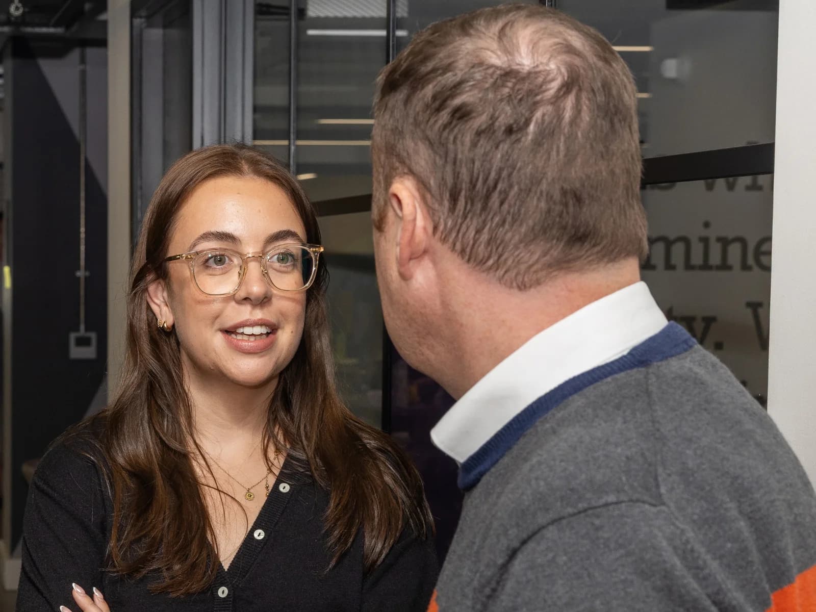 Two professionals having a conversation at UK AI Council event